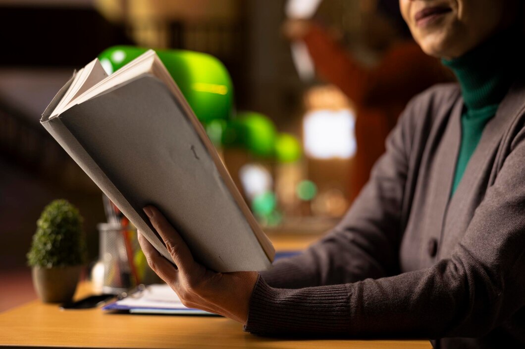 focused-adult-woman-with-book-hand-studying-quiet-library-space_482257-127823