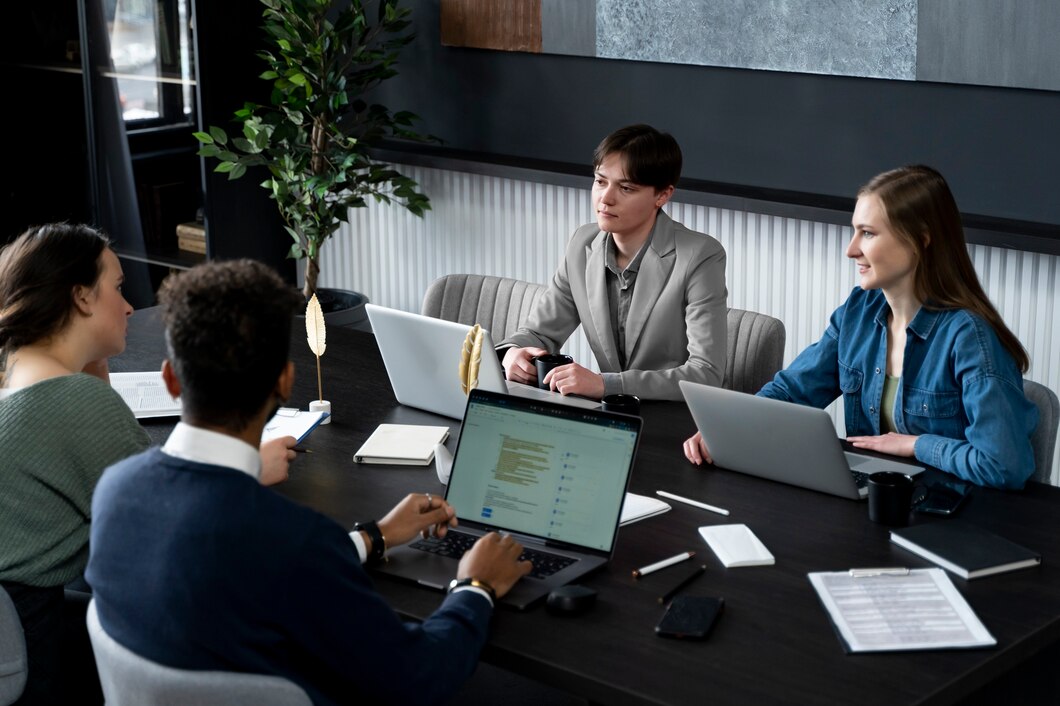 trans-person-working-office-with-colleagues_23-2149286965